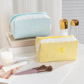 UUYUUY Makeup Bag displayed with beauty products