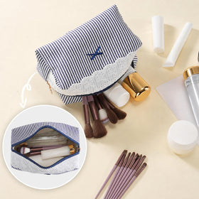 UUYUUY Makeup Bag on a vanity with beauty products
