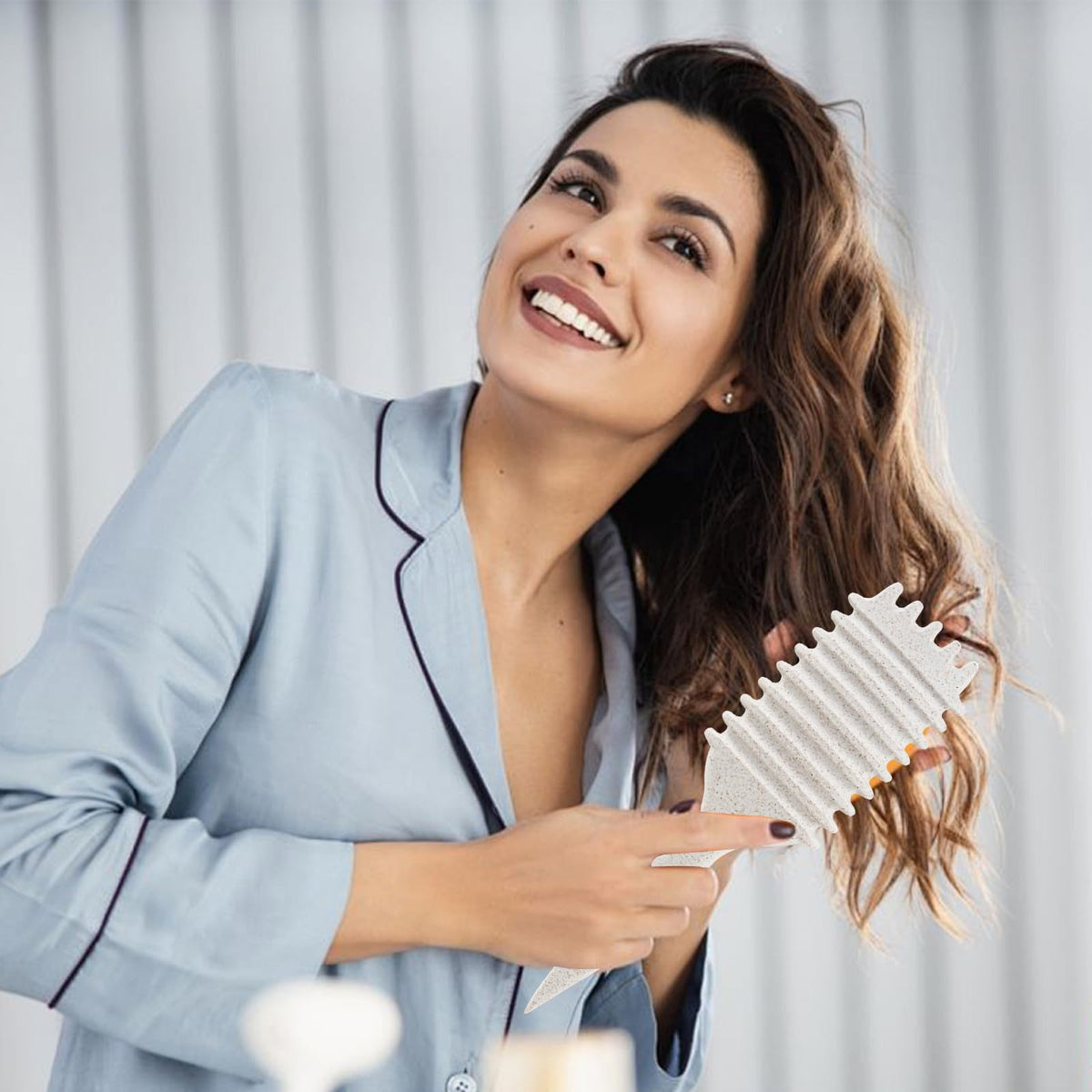 UVZNUMG Curly Hair Brush displayed on a vanity