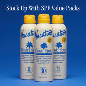VACATION Classic SPF 30 Sunscreen Spray packaging with tropical background