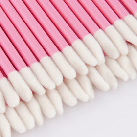 Vaincre lip wands in use applying lip gloss