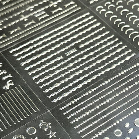 Variety of SPLOCUDU silver nail art stickers displayed