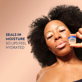 Vaseline Lip Balm Mini Cocoa Butter on a wooden surface