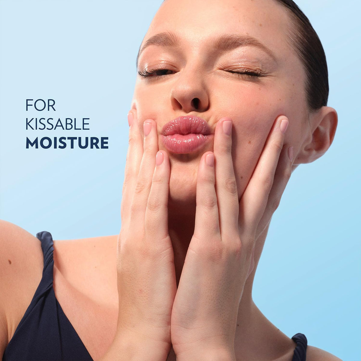 Vaseline Lip Therapy Mini Lip Balm displayed with a soft fabric background