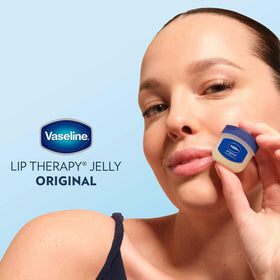 Vaseline Lip Therapy Mini Lip Balm jars on a bathroom shelf
