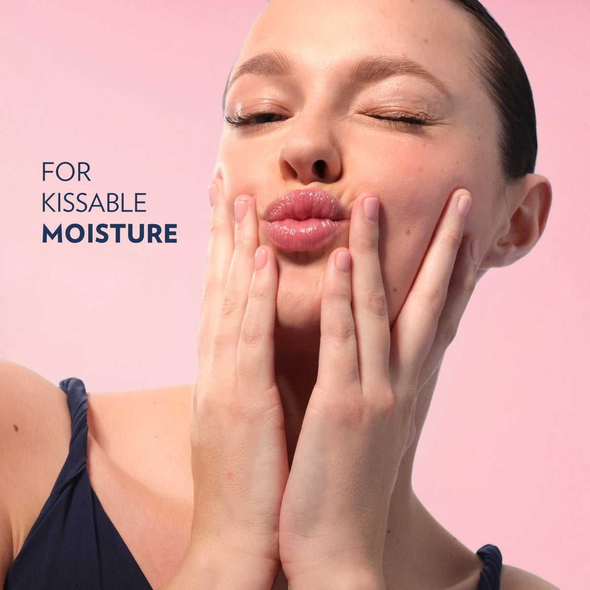 Vaseline Lip Therapy Mini Rosy Lips held in hand for scale
