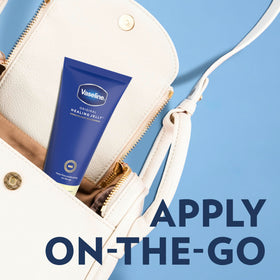 Vaseline Original Healing Jelly 6.8 OZ tube being applied to dry skin
