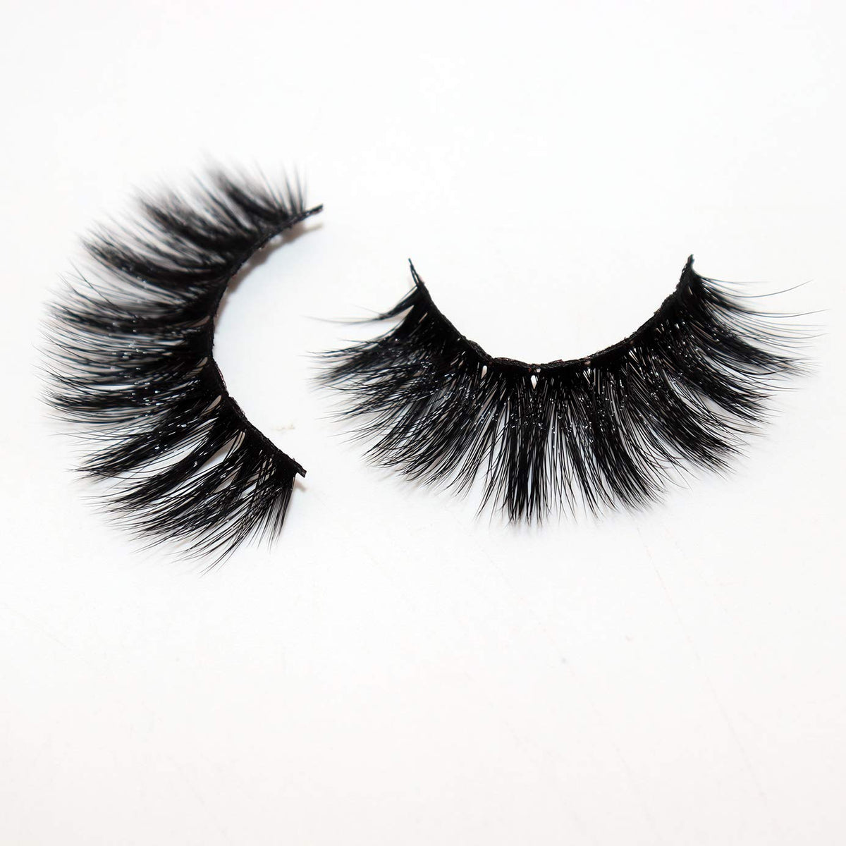 Veleasha 5D Faux Mink False Eyelashes displayed on a makeup table
