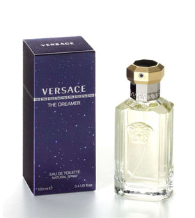 Versace Dreamer Eau de Toilette Spray on a wooden table