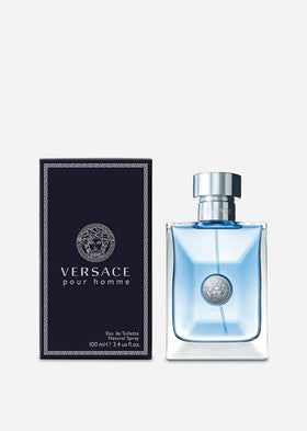 Versace Pour Homme Eau de Toilette Spray 3.4 oz on a dressing table
