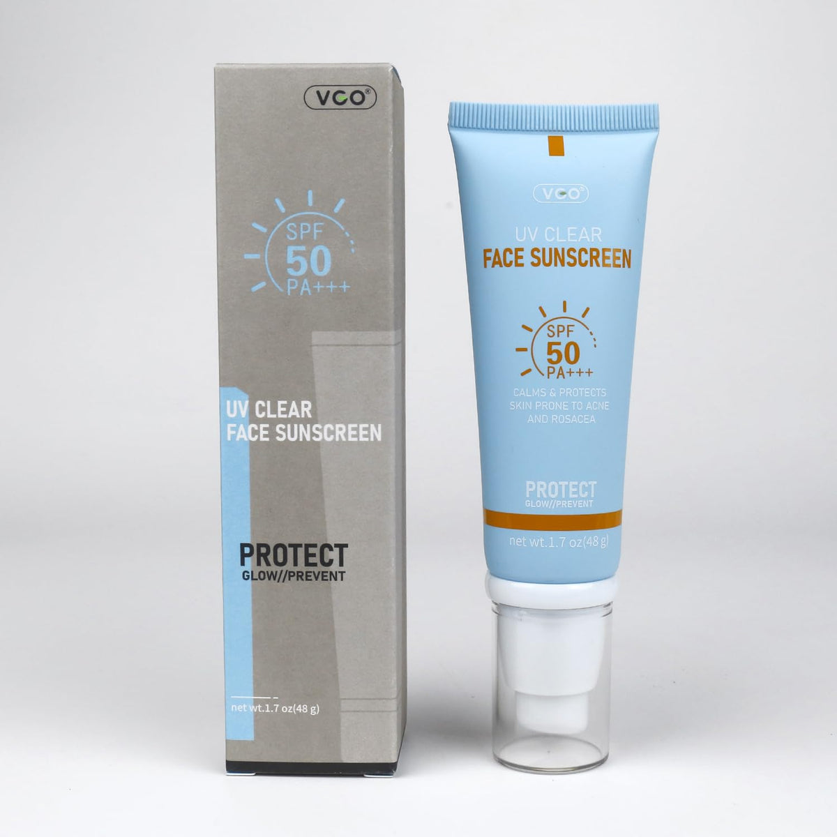VGO Clear Face Sunscreen SPF 50 travel size next to other skincare products