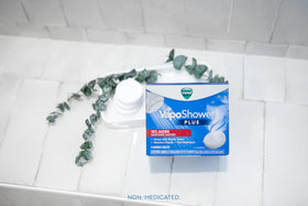 Vicks VapoShower Plus Eucalyptus Shower Steamers displayed with other Vicks products