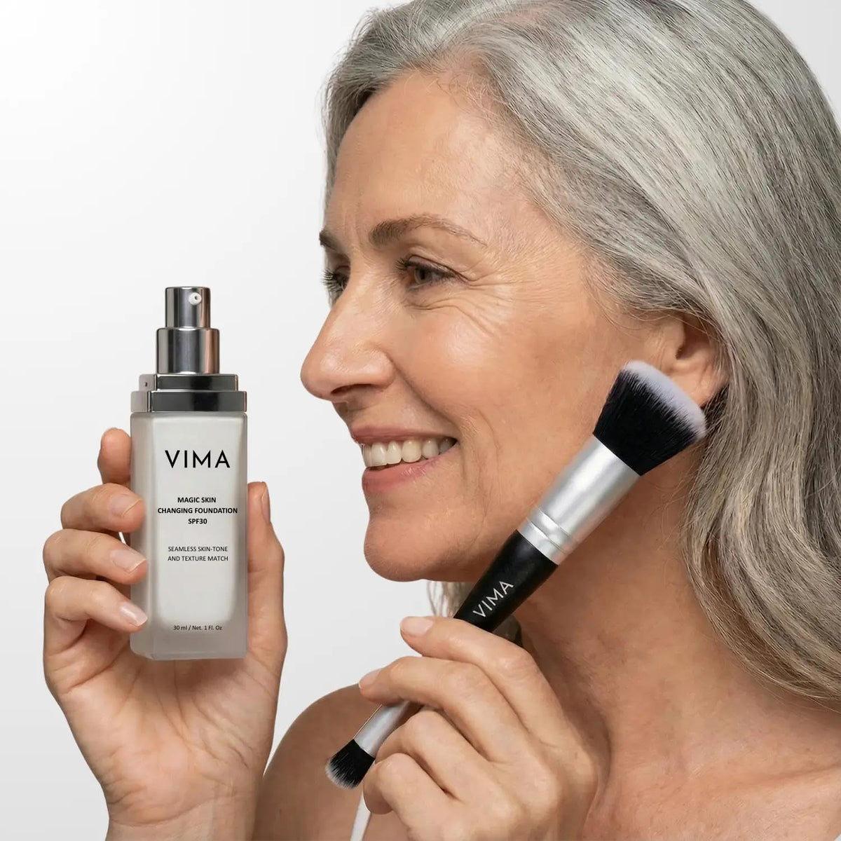 Vima Dual Ended Makeup Brush in use applying foundation