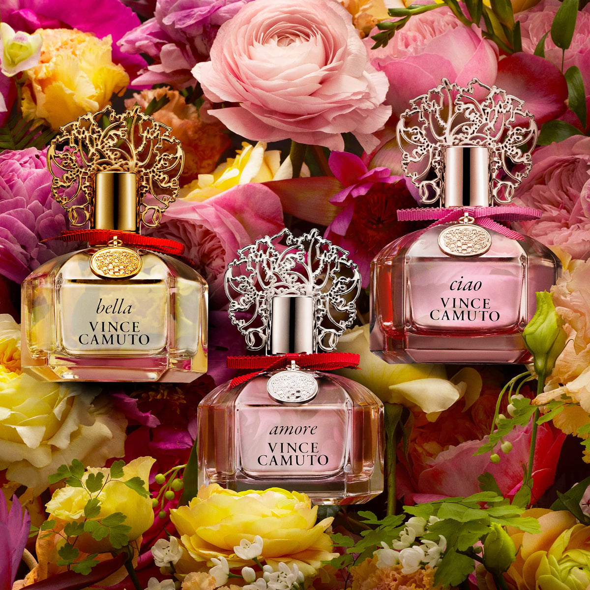 Vince Camuto Bella Eau de Parfum Spray on a vanity with floral accents