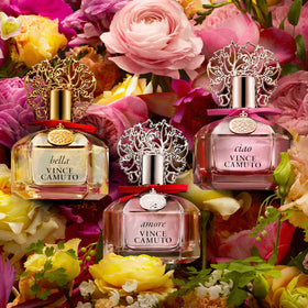Vince Camuto Bella Eau de Parfum Spray on a vanity with floral accents