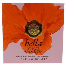 Vince Camuto Bella Eau de Parfum Spray on vanity with flowers