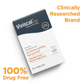 Viviscal Men's Hair Growth Supplements on a wooden table