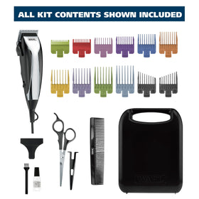 Wahl clipper in use for at-home haircut with a user styling hair