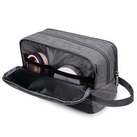 WANDF Travel Toiletry Bag being carried in hand