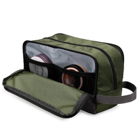 WANDF Travel Toiletry Bag displayed with a suitcase