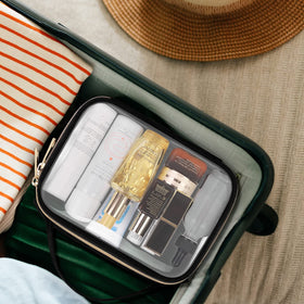 Wedama Clear Toiletry Bag hanging on a hook for easy access