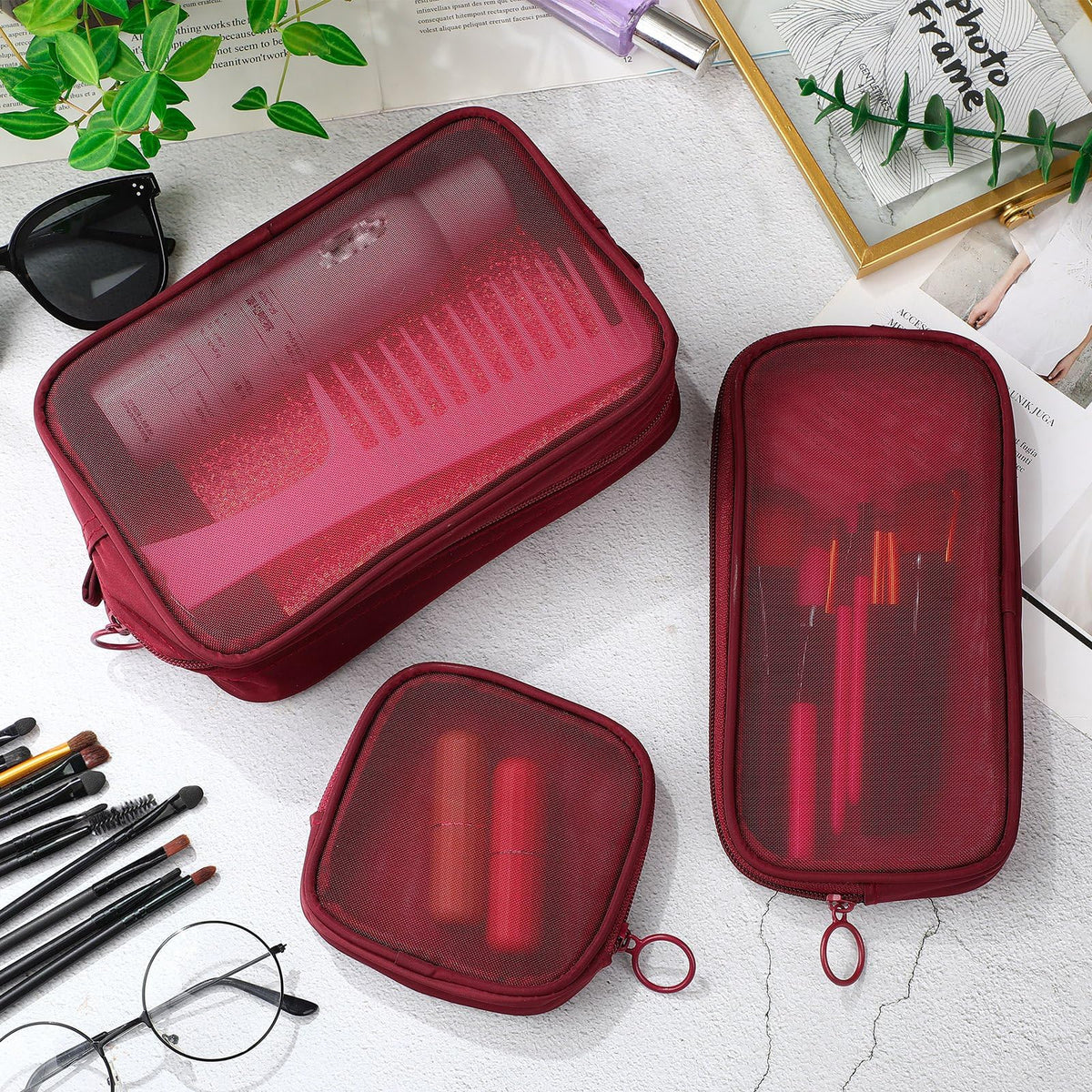 Weewooday Mesh Makeup Bag Set displayed on a travel suitcase