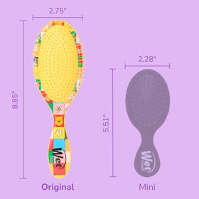 Wet Brush Disney Winnie The Pooh Detangler Hair Brush on a wooden surface