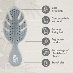 Wet Brush Go Green Mini Detangler held in hand