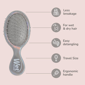 Wet Brush Mini Detangler in hand for travel