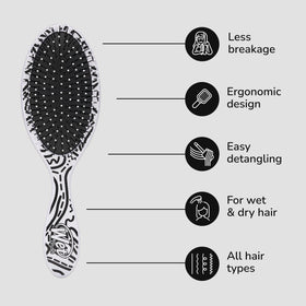 Wet Brush Original Detangler Hair Brush on a bathroom counter with hair products