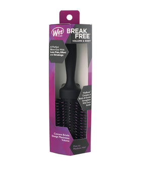 Wet Brush Volumizing Round Brush in lifestyle setting with hair styling tools
