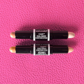 wet n wild MegaGlo Dual-Ended Contour Stick Light Medium on a makeup table