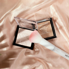 wet n wild MegaGlo Highlighting Powder Warm Gold close-up of product