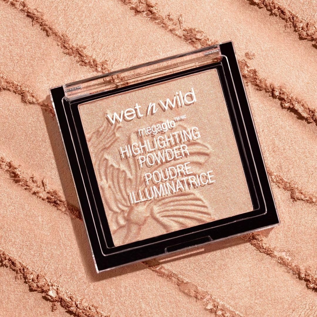 wet n wild MegaGlo Highlighting Powder Warm Gold swatch on skin