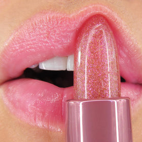 Winky Lux Pink Opal Glimmer Balm displayed with raspberry and vanilla