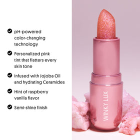 Winky Lux Pink Opal Glimmer Balm on a flat lay background