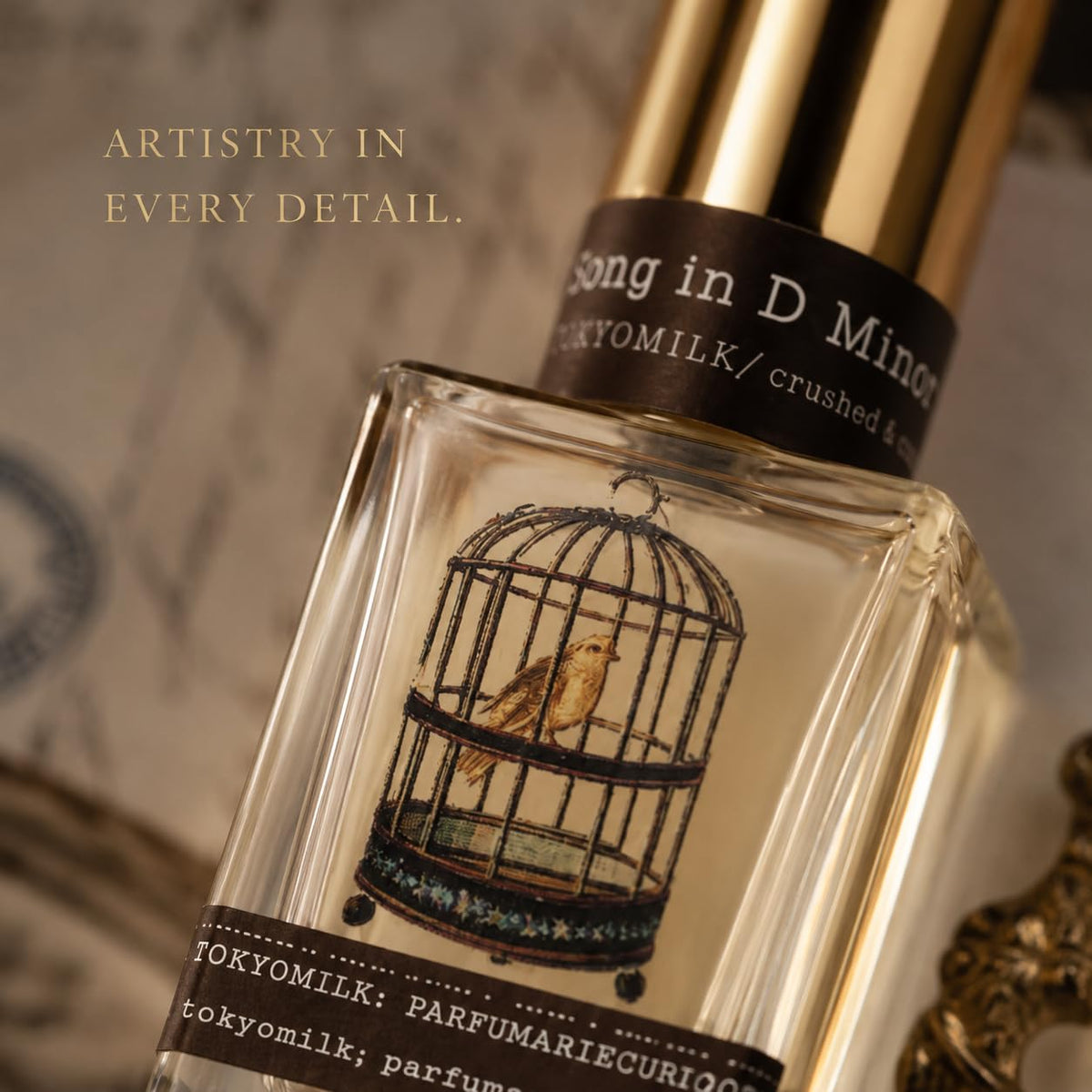 Woman holding TOKYOMILK Song in D Minor Eau de Parfum