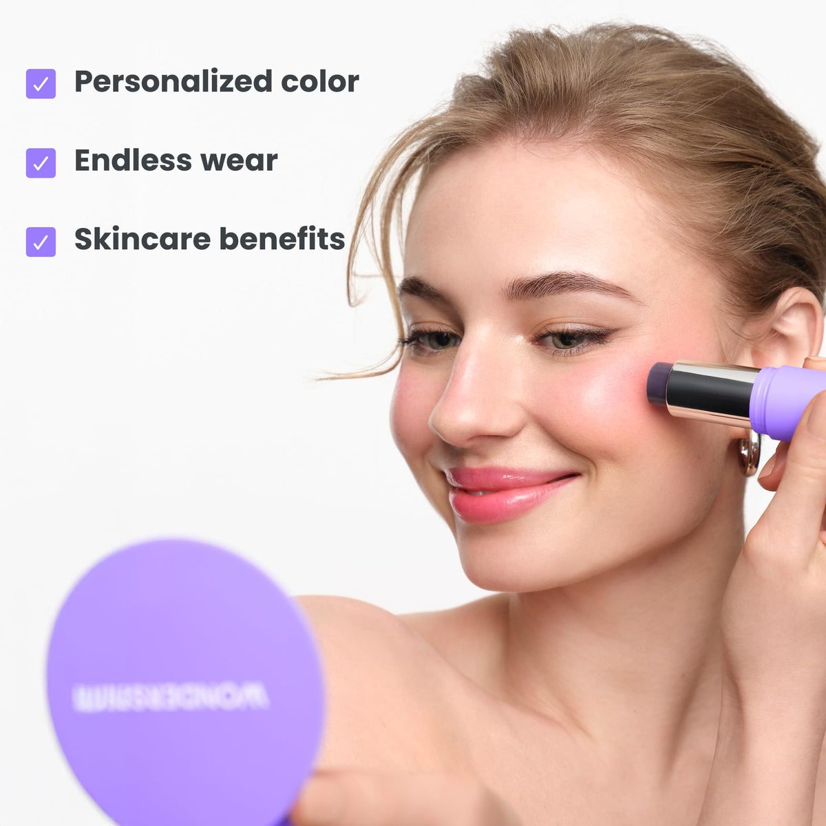 Wonderskin pH-Activated Cream Blush Stick in use on cheeks