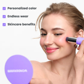 Wonderskin pH-Activated Cream Blush Stick in use on cheeks