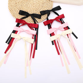 WORTL hair bows with long tails in a hairstyle