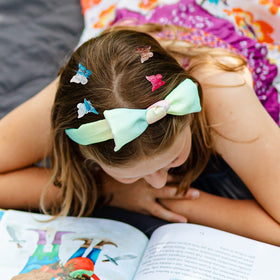 XIEHE butterfly hair clips in a stylish hairstyle