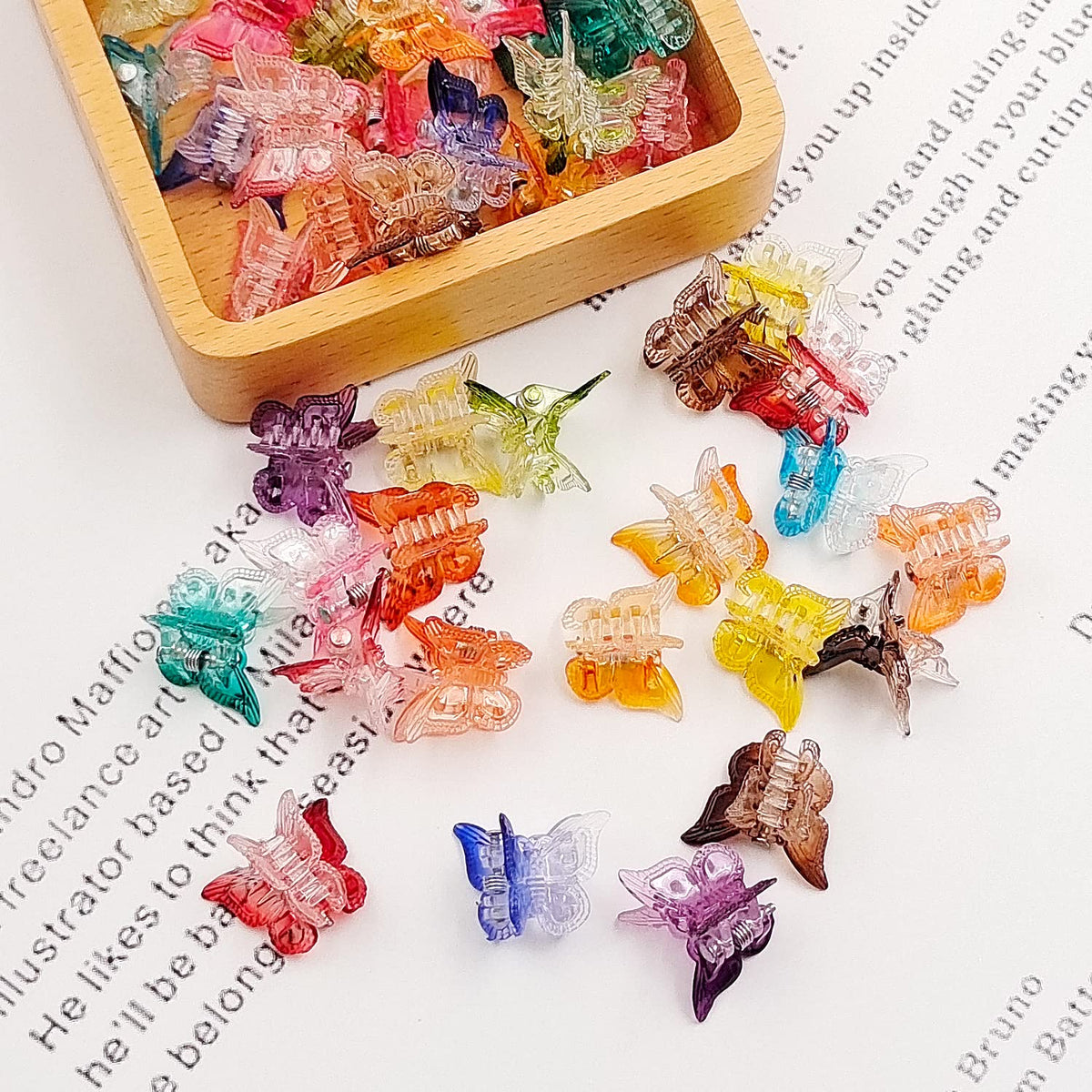 XIEHE butterfly hair clips showing size comparison in hand