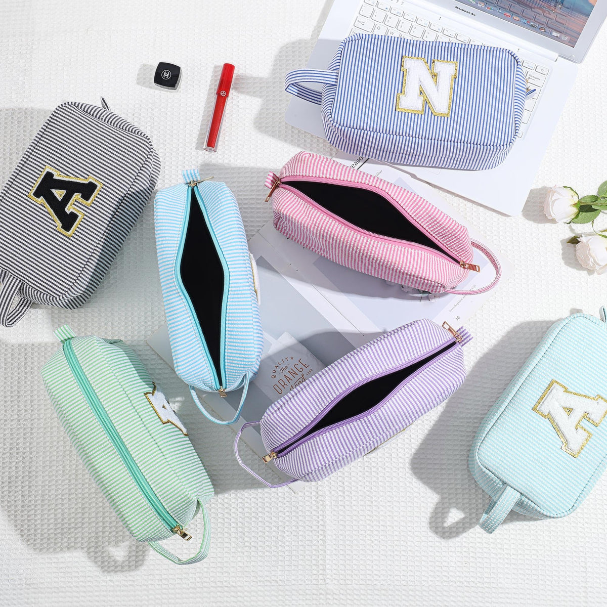 YOOLIFE Initial Makeup Bag displayed with cosmetics inside