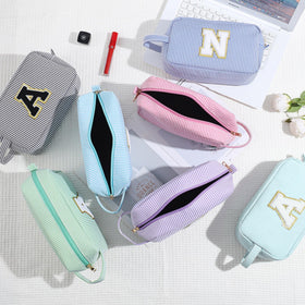 YOOLIFE Initial Makeup Bag displayed with cosmetics inside