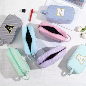 YOOLIFE Initial Makeup Bag in a suitcase for travel