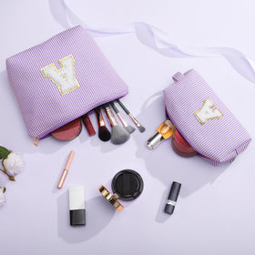 YOOLIFE makeup bag with initial displayed on a table