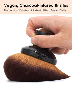YOSHUYUKI Kabuki Brush in use applying self-tanner on legs