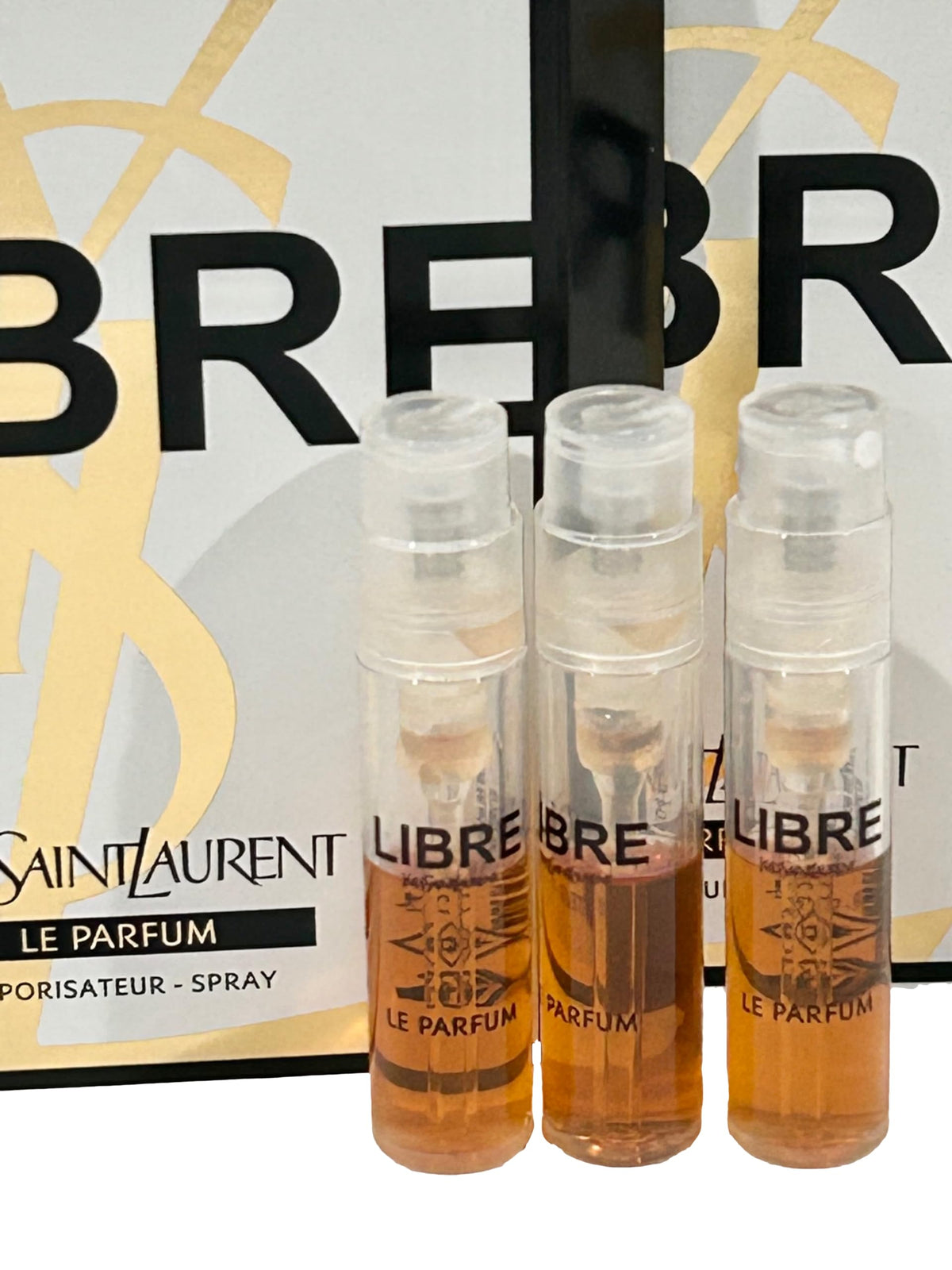 Yves Saint Laurent LIBRE LE PARFUM sample vials on a table