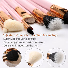 Z'OREYA makeup brushes arranged in a chic pink clutch bag