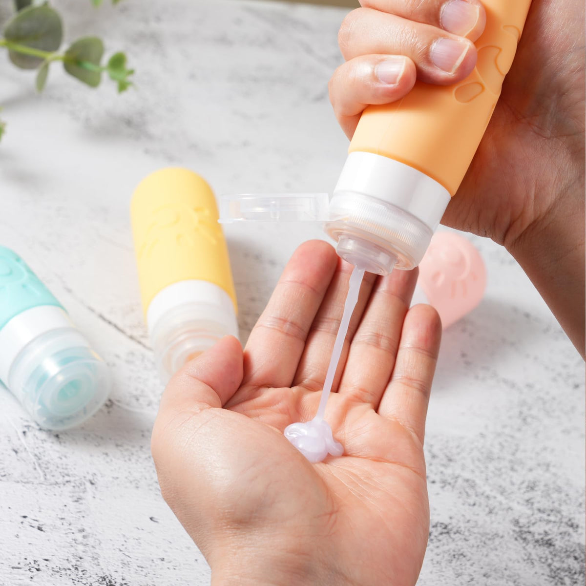 Zafit travel bottles with a gym setting background
